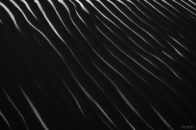 Black and white, abstract image of sand at White Sands National Monument in New Mexico, reminiscent of a zebra.