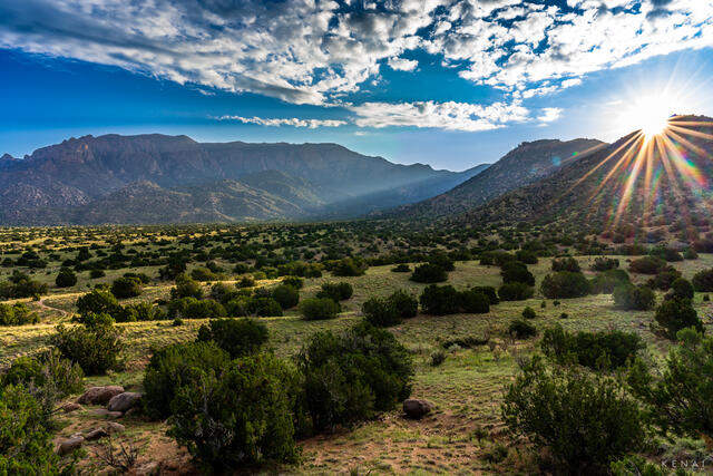 Sunrays illuminate the Sandia Mountains of Albuquerque, New Mexico in this sunrise image. 
