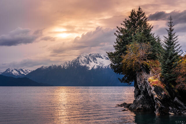 The sun sets over Prince William Sound and Valdez, Alaska.