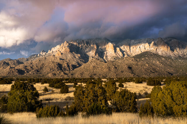 A winter sunset on the north Sandia Mountain of Albuquerque,  New Mexico.