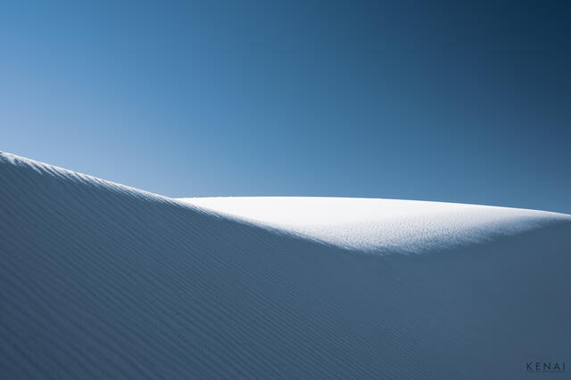 An abstract image of sand dunes at White Sands National Park in New Mexico. 