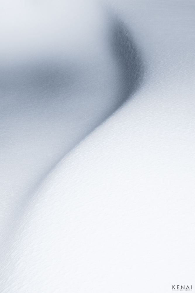 Abstract snow photography resembles a question mark in Alaska.