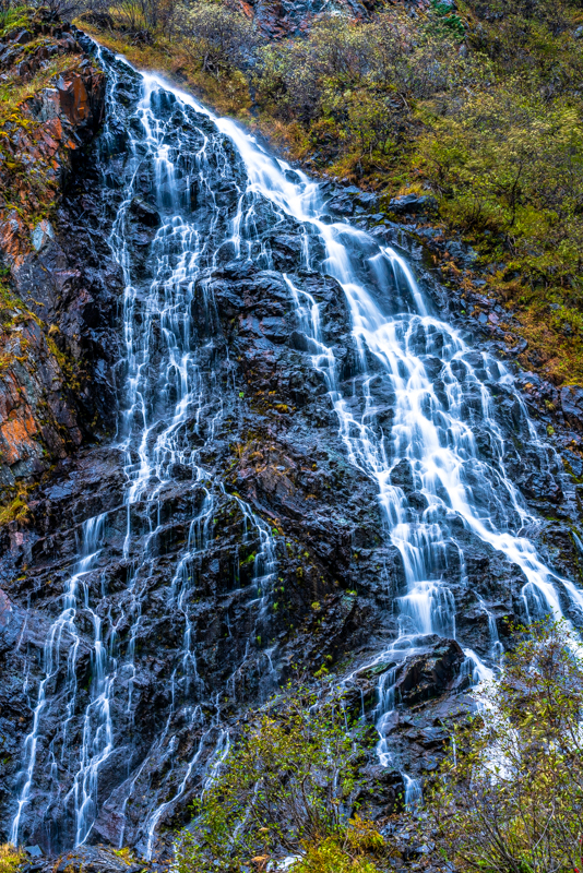 A waterfall punctuates the beautiful landscape near Valdez, Alaska.